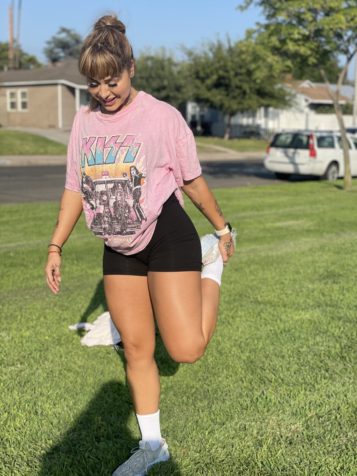 Jaz stretching outdoors in a park