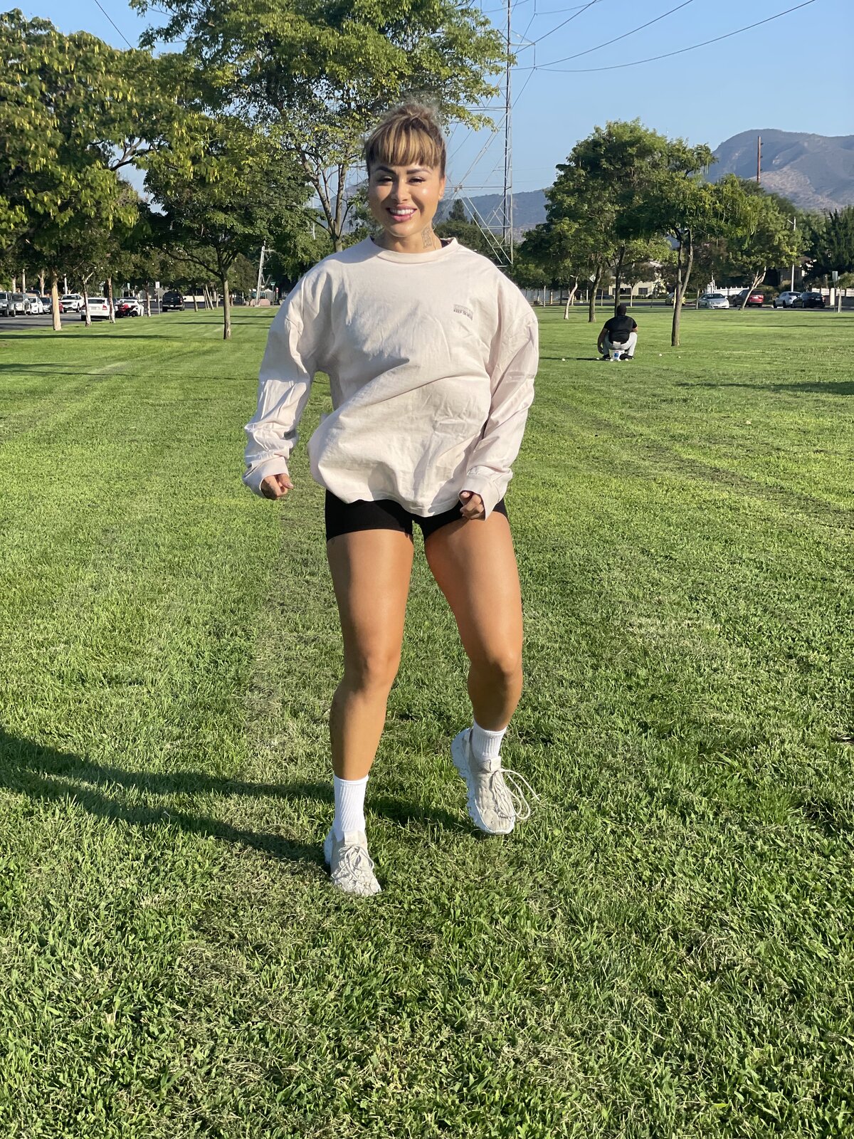 Jaz walking outdoors in a park